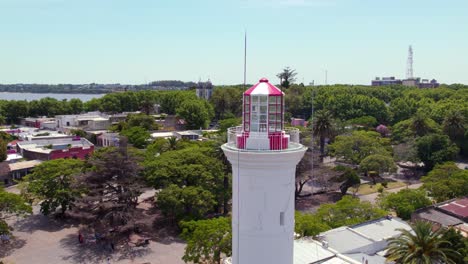 Aerial-orbit-near-the-top-of-the-Faro-de-Colonia-lighthouse-in-the-historic-center-of-Colonia-del-Sacramento,-Uruguay