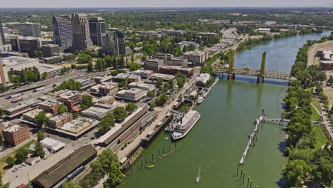 Sacramento-City-California-Aerial-v19-establishing-drone-flyover-river-capturing-tower-bridge,-old-town-riverfront-historic-district-and-downtown-cityscape-views---Shot-with-Mavic-3-Cine---June-2022