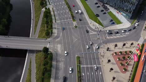Cars-driving-on-King-Mindaugas-avenue-in-Kaunas-city,-aerial-drone-view
