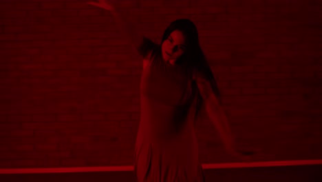 Fast-female-dancer-dancing-in-a-red-room