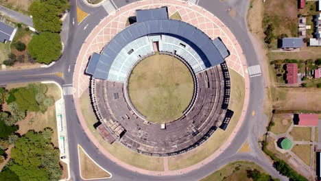 Overhead-spinning-aerial-view-of-the-coliseum-of-the-Plaza-de-Toros-Real-de-San-Carlos-in-Colonia-del-Sacramento,-Uruguay