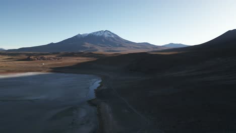 Aerial-Above-Lagunas-Route,-Volcanic-Peaks,-Lagoon-Wetland-in-Natural-Reservoir,-San-Pedro-de-Atacama-Desert,-Bolivia-Travel-and-Tourism