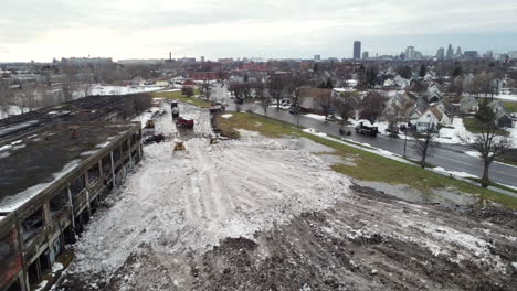 Aerial-view-of-Cleanup-works-aftermath-of-a-deadly-snowstorm,-Snowplows-machines-working-during-daytime