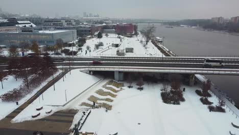 Drone-video-of-Vistula-river-and-bridge-in-warsaw-on-a-cold-snowy-winter-day