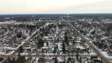 Aerial,-small-town-rural-residential-neighborhood-in-the-United-States-during-winter-season,-overcast-day