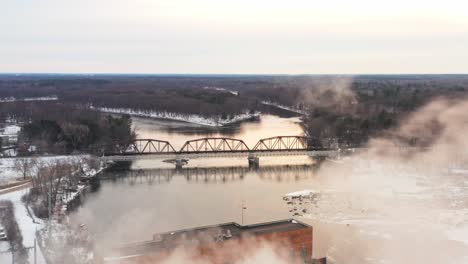 Aerial,-Wisconsin-River-in-Stevens-Point-during-winter-season