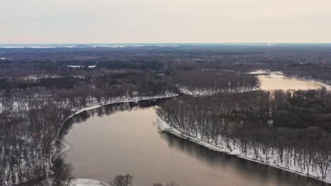 Aerial,-winding-Wisconsin-River-during-winter-season-on-an-overcast-day