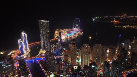 Colour-illuminated-high-rise-buildings-and-Bluewaters-Island-at-Dubai-marina