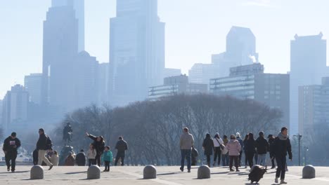 People-walking-towards-the-Philadelphia-Museum-of-Art-with-skyscrapers-in-the-background-in-slow-motion