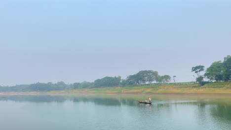 Establisher-handheld-shot-of-Asian-traditional-fishing-boat-in-middle-of-river