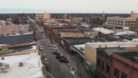 Aerial,-drone-flying-down-Main-Street-of-a-small-town-in-the-United-States