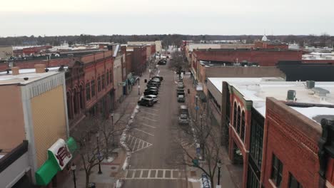 Aerial,-main-street-in-a-small-town-in-the-united-states-during-winter-season