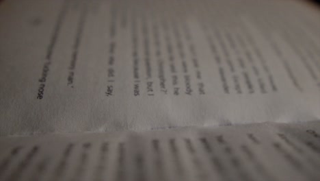 Close-up-of-an-open-book-page-with-out-of-focus-words