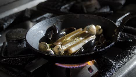 Mussels-and-seafood-cooking-in-pan-with-herbs