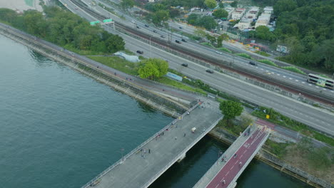 aerial-top-down-of-asphalted-road-bridge-connecting-the-Downton-of-Hong-Kong-asiatic-Chinese-main-city-with-traffic-and-pollution