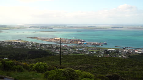 Bluff-in-New-Zealand,-view-from-above-Bay-Industrial-harbor,-peninsula-located-in-New-Zealand,-aerial-drone-distance-view