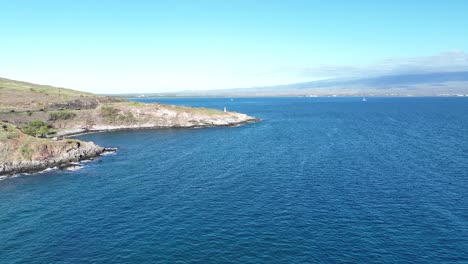 Drone-Approaching-The-McGregor-Point-Lighthouse,-A-Popular-Destination-For-Locals-And-Tourists-To-Watch-Whales-Passing-By