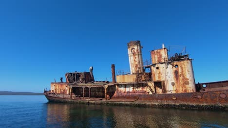 Old-abandoned-ship-that-ran-aground-and-has-rusted-in-the-elements