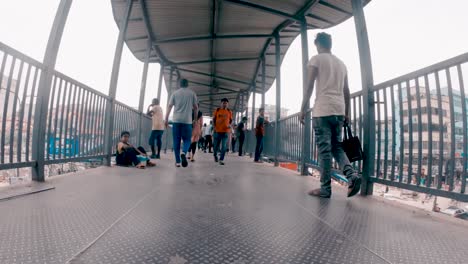 Time-lapse-of-a-foot-over-bridge-people-are-passing