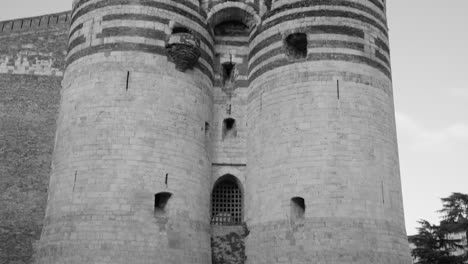 Medieval-Castle-Of-Angers-In-France---black-and-white,-tilt-down