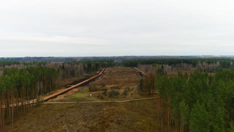 Deforested-area-for-Rail-Baltica-bridge-construction-site-near-Jonava-city,-aerial-view