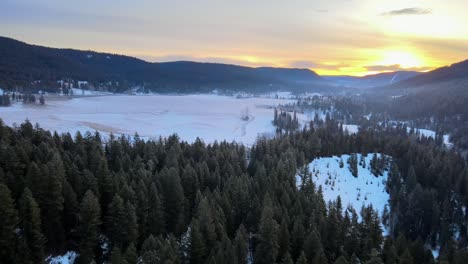 Aerial-Tour-of-Cariboo-Forest-and-Farmland-at-Winter-Sunrise,-British-Columbia