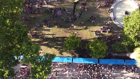 Overhead-scene-of-gay-pride-parade-of-Buenos-Aires-with-waving-rainbow-flag