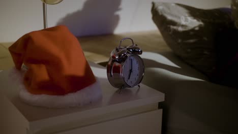 Santa-claus-hears-the-alarm-clock-and-wakes-up