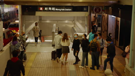 people-standing-in-front-of-tube-underground-station-in-modern-city-center