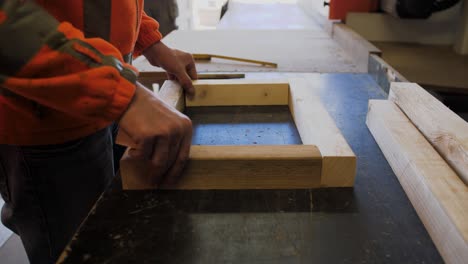 Man-is-assembling-wooden-blocks