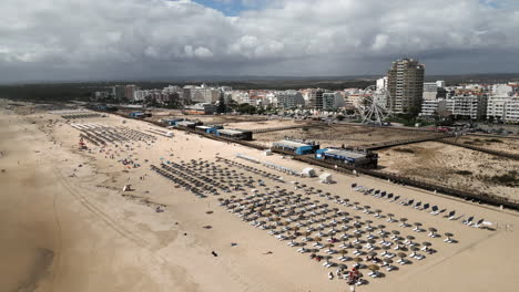 Wide-Drone-Shot-Flying-Over-a-Beach-in-Algarve,-Portugal