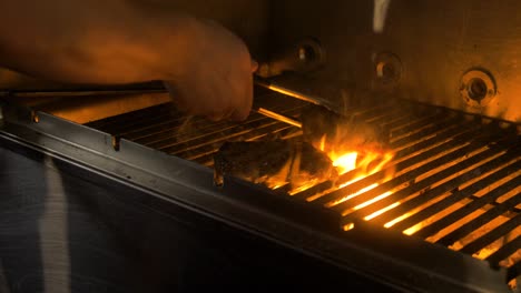 Cheff-grills-meat,-with-flames