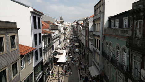 Drone-Shot-Through-Shopping-Streets-of-Porto,-Portugal