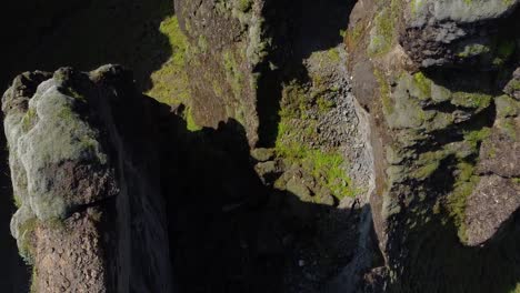 Fjaðrárgljúfur-Canyon-Cliffs-in-aerial-drone-downwards-shot,-Iceland