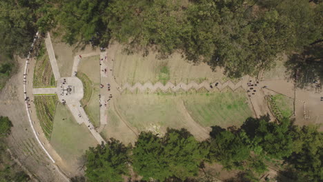 Static-top-down-aerial-footage-of-visitors-at-the-Cerro-de-La-Cruz-in-Antigua,-Guatemala