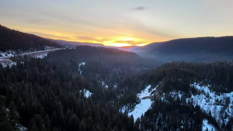 Aerial-View-of-Cariboo-Region-Forest-in-Winter-Sunrise,-BC