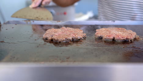 three-pieces-of-Beef-burger-is-cooking-on-the-grill