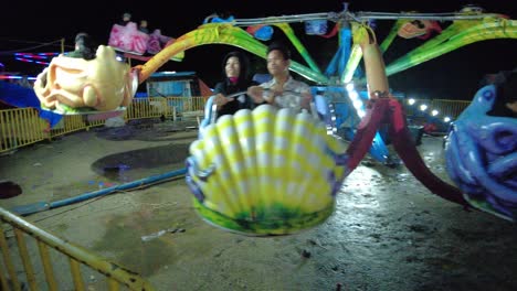 A-dynamic-shot-of-an-octopus-ride-in-an-amusement-park-which-spins-the-passengers-around-while-it-goes-up-and-down