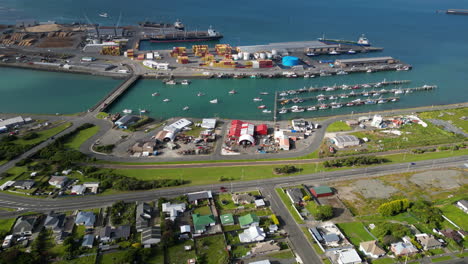 Aerial-view-of-industrial-port-in-bluff-with-many-ships-docked-at-day-time