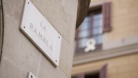 La-Rambla-signboard-on-building-wall,-sharp-focus-reveal-shot