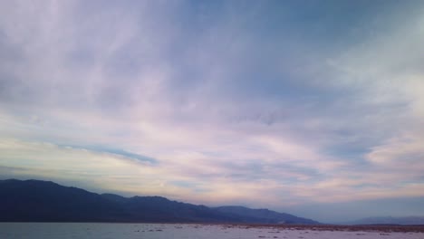 Gimbal-booming-down-shot-from-the-sky-to-the-salt-flats-at-Badwater-Basin-in-Death-Valley,-California