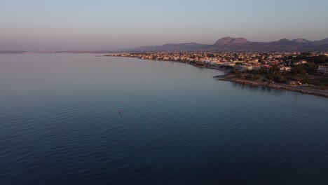 Sunset-view-from-drone-to-Mediterranean-seascape-in-Vrahati,-Greece-|-4K