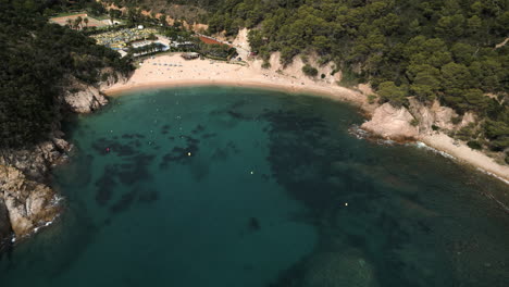 Drone-Shot-Coming-Down-on-Spanish-Beach-in-Giverola,-Costa-Brava