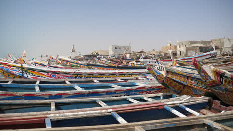 Colorful-Painted-Fishing-Boats-on-Coast-of-Western-Africa,-Atlantic-Ocean-Coastline-of-Mauritania