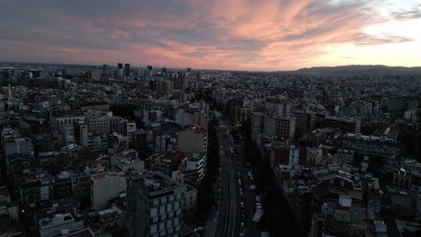 Sunset-Cloudy-Drone-Shot-Over-Cityscape-in-Barcelona,-Spain