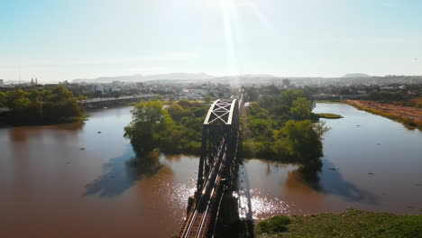 Bird's-eye-perspective-of-iron-bridge-and-skyline-metropolis-panorama