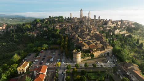 Aerial-Panoramic-View-Over-San-Gimignano-During-Foggy-Early-Morning-In-Siena,-Tuscany,-North-central-Italy