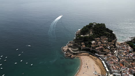Top-Down-Drone-Shot-Coming-Down-on-Coastline-Castle-in-San-Sebastian,-Basque-Country