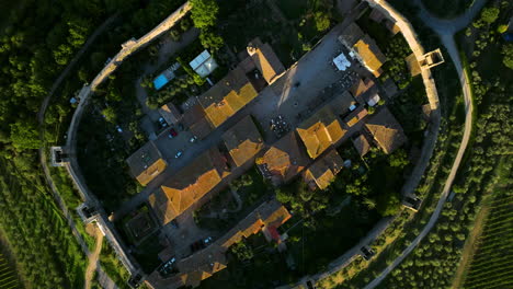 Topdown-View-Of-Monteriggioni-Small-Town-Amidst-Greenery-Landscape-In-Tuscany,-Italy
