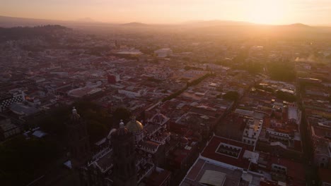 Aerial-footage-of-the-colonial-City-of-Puebla-in-Mexico-during-the-sunrise